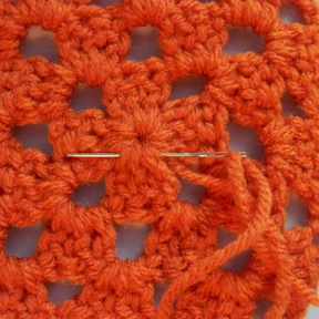 Weaving in the tail at the center of the motif.