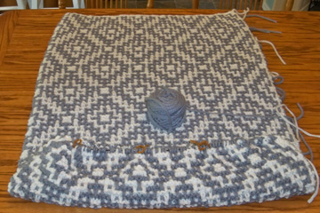 Mosaic blanket being knit on table